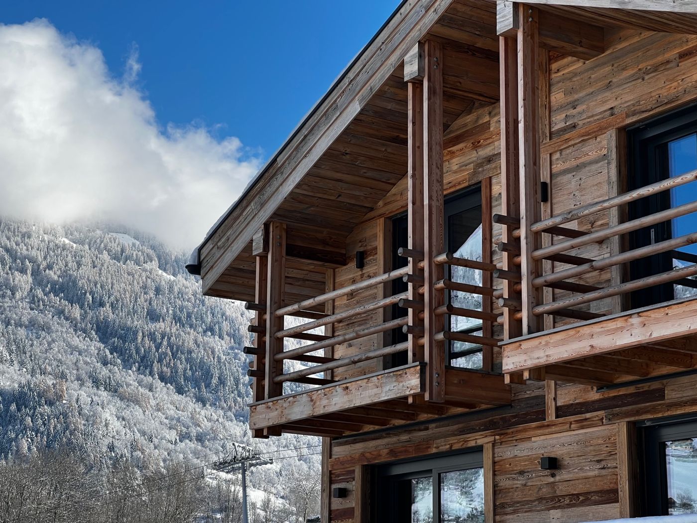 Timber balcony of a chalet in the snow above the Val de Bagnes